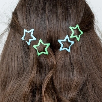Blue and green star hair clips in a set of four.