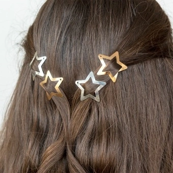 Gold and silver star hair clips in a set of four.