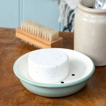 Round two-part soap dish with drainage holes in sage green.