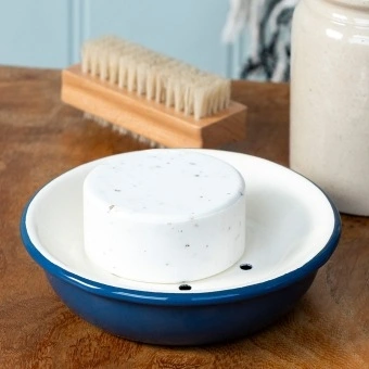 Round two-part soap dish with drainage holes in blue.
