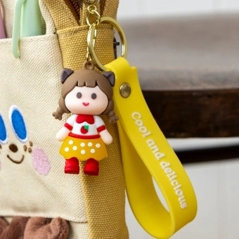 Strawberry girl bag charm with yellow polka dot skirt, silicone wrist strap and keyring