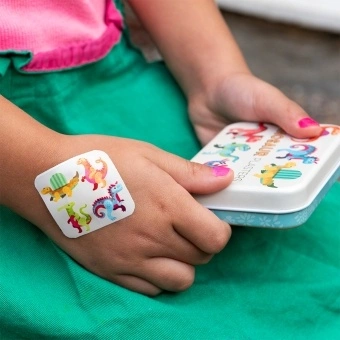 Dinosaur plasters in tin with individual plasters shown.