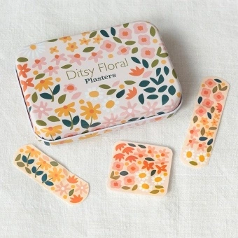 Floral plaster tin with matching flower-patterned plasters 