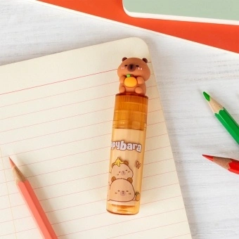 Capybara eraser in a plastic tube with a capybara figure on the lid.