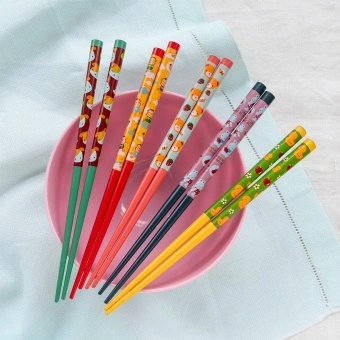 Set of five pairs of colourful chopsticks with cute animal and fruit designs