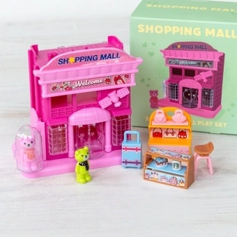 Pink toy shopping mall play set with miniature storefront and packaging box
