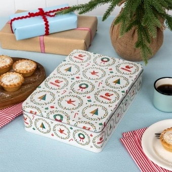 Rectangular storage tin decorated with Christmas tree, baubles, wreaths and candy canes.