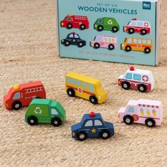 Set of six wooden toy vehicles with storage box, including bus, ambulance and fire engine