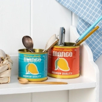 Decorative storage tins featuring vintage-style mango illustrations