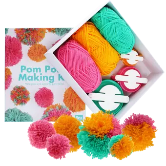 Pom‑pom making kit with colorful yarn, pom‑pom tools, and finished pom‑poms.