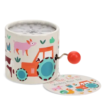 Farmyard‑themed winding music box with illustrated tractor and animals, featuring a red turning handle with tag.
