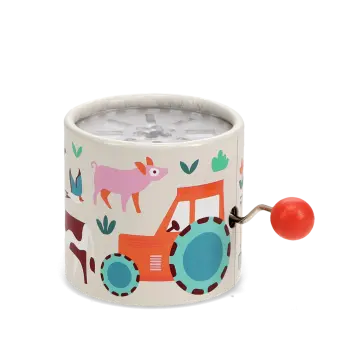 Farmyard‑themed winding music box with illustrated tractor and animals, featuring a red turning handle.