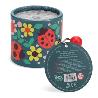 Winding music box with illustrated flowers and ladybird design, featuring a red turning handle with tag.