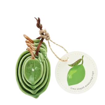 Stackable ceramic measuring spoons shaped like green leaves with brown stem handles with tag