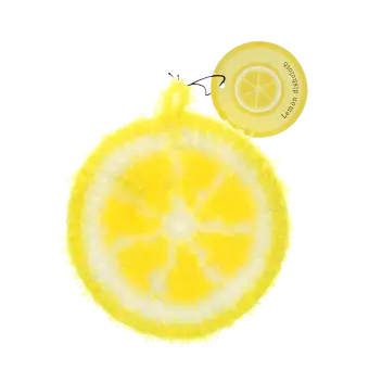 Lemon–shaped dishcloth with a yellow textured surface and hanging loop with tag.
