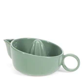 Green ceramic lemon squeezer with handle and spout