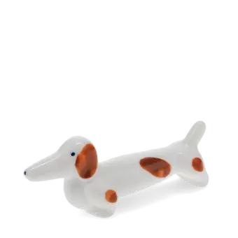 Ceramic sausage dog chopstick rest with brown patches 