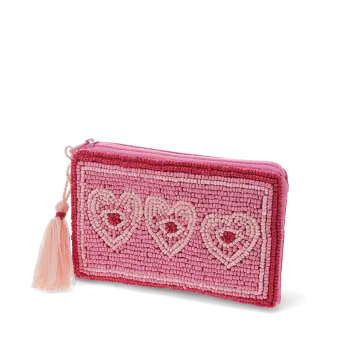 Pink beaded purse with three heart designs and a pale pink tassel.