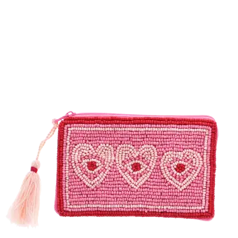 Pink beaded purse with three heart designs and a pale pink tassel.