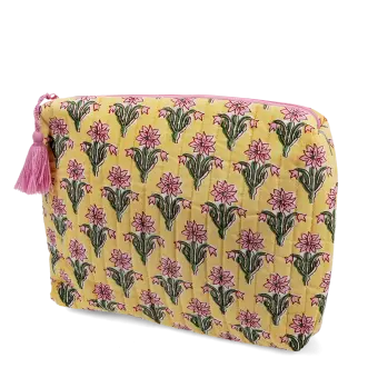 Yellow quilted wash bag with a pink and green flowers design.