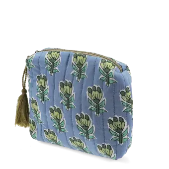 Blue quilted makeup bag with green and blue flowers.