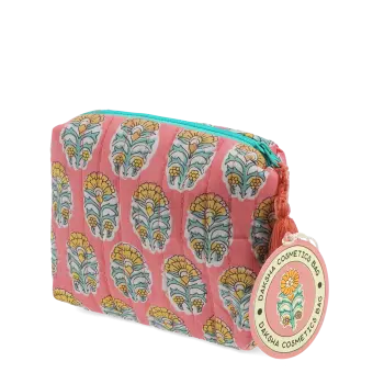 Pink quilted wash bag with orange and green flowers design and a tag.