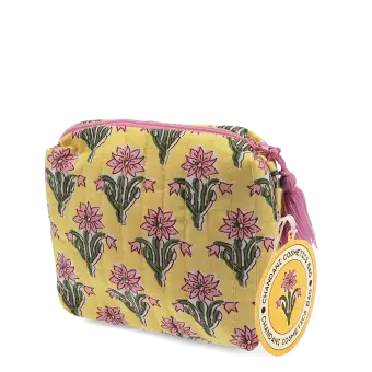 Yellow quilted cosmetic bag with a pink and green floral print and a pink tassel on the zip with tag.