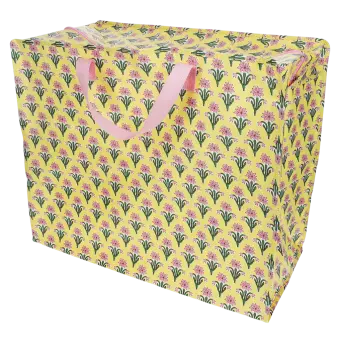 Yellow jumbo storage bag with a pink floral pattern and pink handles.