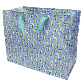 Large blue storage bag with green floral pattern and turquoise handles.