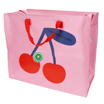 Large pink storage bag with a bold cherry graphic and red handles with tag.