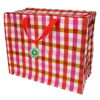 Large storage bag with a red, pink, and white gingham pattern and red handles with tag.