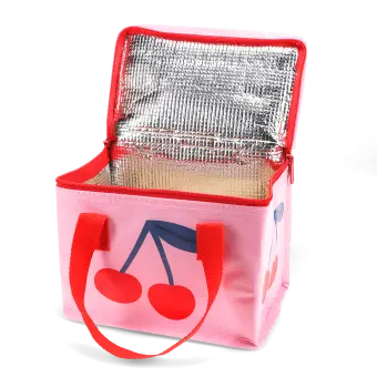 Pink insulated lunch bag with a bold cherry design and red handles, shown open with a silver foil-lined interior.