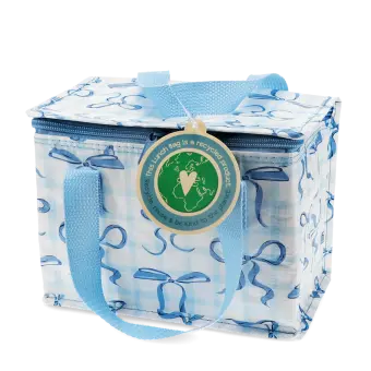Insulated lunch bag with a light blue bow pattern and light blue handles with tag.