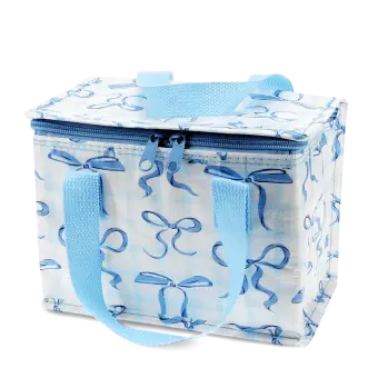 Insulated lunch bag with a light blue bow pattern and light blue handles.