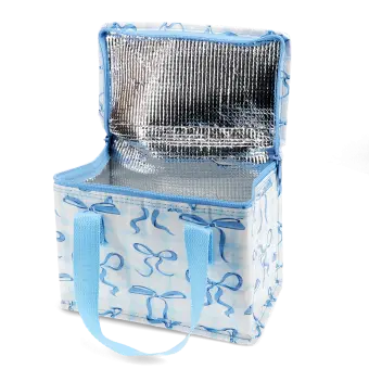 Insulated lunch bag with a light blue bow pattern and light blue handles, shown open with a silver foil-lined interior.