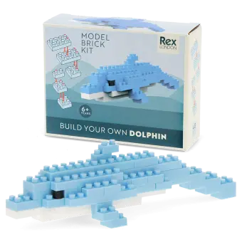 Completed dolphin brick model displayed beside its packaging box.