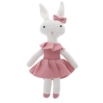 Knitted rabbit toy with long ears, wearing a pink dress with a ruffled collar and a matching bow on one ear