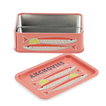 Open pink mini storage tin with the lid beside it, featuring an illustrated anchovies on the lid.