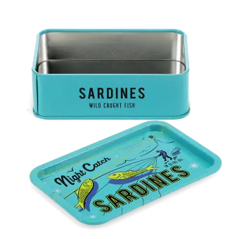 Open mini storage tin with the lid beside it, featuring an illustrated sardines on the lid.