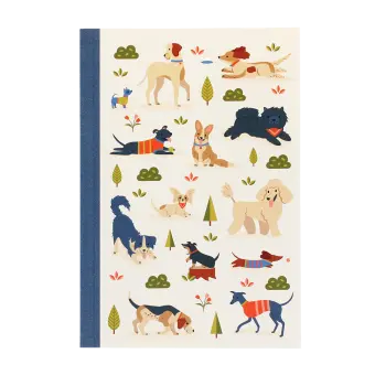 Notebook with illustrated dogs in a park scene on the cover.