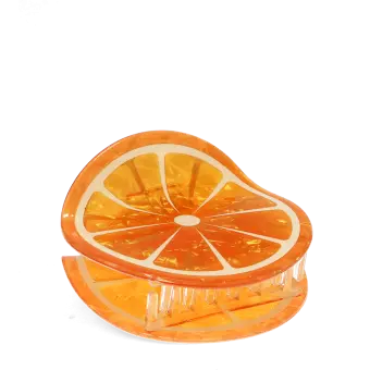 Hair claw clip featuring a fruity orange slice design, with hints of marbling and translucence. 