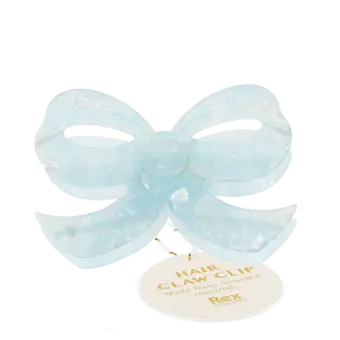 Hair claw clip featuring a pretty bow design in blue, with hints of marbling and translucence. 