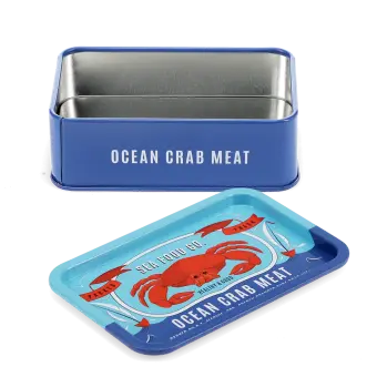 Open blue mini storage tin with the lid beside it, featuring an illustrated crab on the lid.