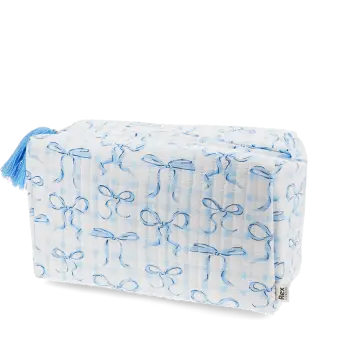 Light blue quilted washbag with a bow pattern and tassel.