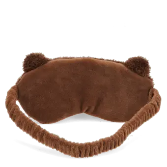 Brown plush teddy bear–shaped travel eye mask with embroidered facial features.
