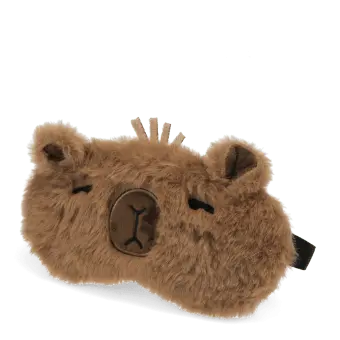 Light brown plush capybara‑shaped travel eye mask with stitched facial details