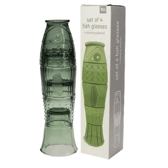 Stacked green glass tumblers placed beside box