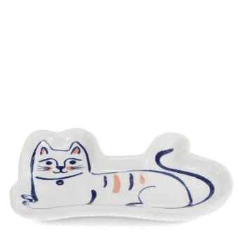 White ceramic trinket dish shaped like a reclining cat with simple blue and orange details.