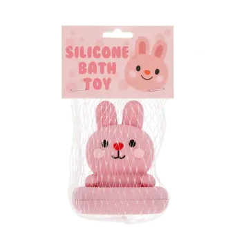 Pink silicone bunny bath toy with upright ears and simple face, in a packaging