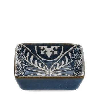 Blue ceramic square dish with white floral pattern interior